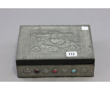 Early 20th C Arts and Crafts pewter covered playing card box with embossed decoration and cabouchon stones