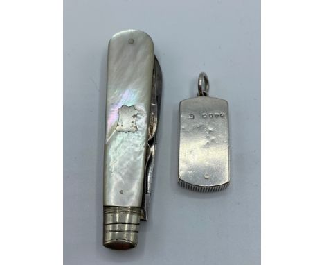 A sterling silver vesta case together with a sterling silver and mother of pearl handled pen knife cutlery set by William Now
