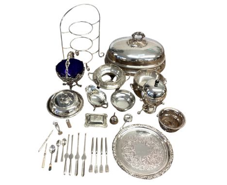 A collection of silver plated wares to include a blue glass lined sweet meat dish, cloche and sterling silver lidded butter d