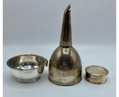 A sterling silver wine funnel and filter. Thomas Whipham, London 1808. Together with a boxed sterling silver napkin ring. 152