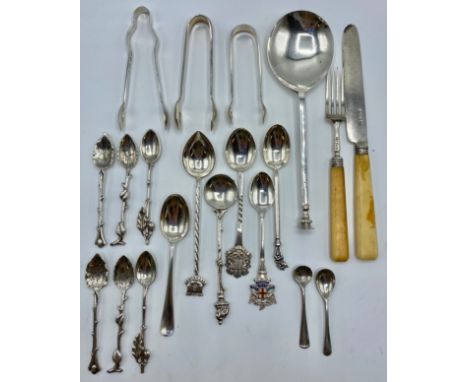 A 18th century sterling silver spoon together with a collection of sterling silver and white metal cutlery items and a pair o