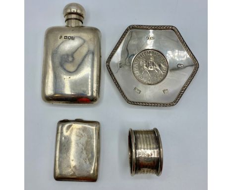 A collection of small sterling silver items to include a hip flask, coin set pin dish napkin ring etc, Various dates and make
