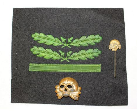 WW2 Third Reich SS first pattern cap skull. Deathshead stick pin and a machine embroidered Waffen SS/Heer camo uniform rank p