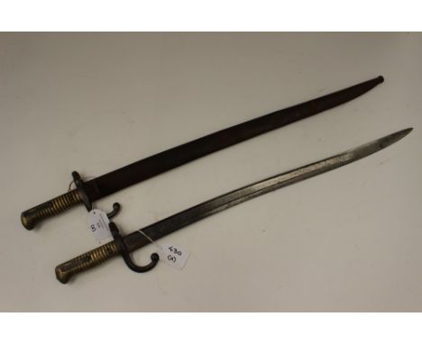 Pair of French Model 1866 "Chassepot" (Yataghan) Sword Bayonets. One with scabbard which is marked to spine "WM". Part of the