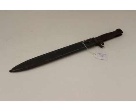 WW1 Imperial German Ersatz Bayonet with cast metal grip and 31cm blade. Pressed metal grey painted scabbard marked "FAG" (Fis
