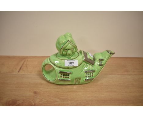A vintage art deco Lingard english novelty ceramic teapot, depicting the old woman who lived in a shoe. Having No5 to base.
