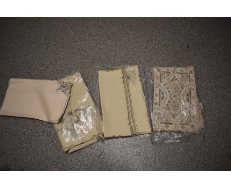 A collection of unused vintage Medeira work table linen.
