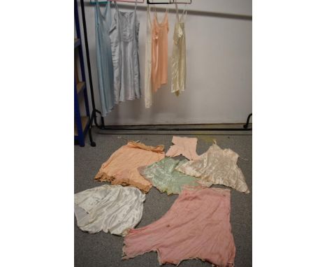 An assortment of vintage and antique lingerie, including slips, cami knickers and teddys, some af.