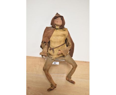 An unusual leather clad wire-work figure or puppet, depicting a young gentleman in hooded medieval attire, his joints articul