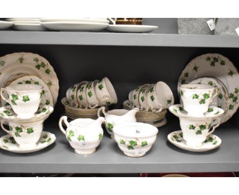 A Colclough china tea set decorated in an Ivy Leaf pattern and comprising teacups, saucers, cream jugs, sucrier, and sandwich