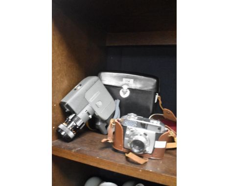 A vintage Canon reflex zoom 8-2 cine camera in case and a Balda Balessa lb F2.8 45mm lens Prontor-SVS camera.