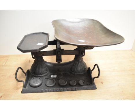 A set of Victorian cast-iron 'registered' scales, of traditional design with moulded acanthus detail, two loop carrying handl