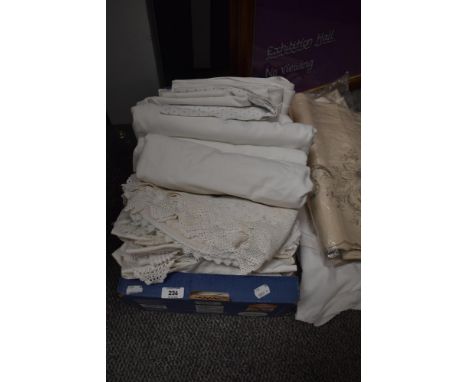 A collection of vintage and antique bed linen, table linen and huckaback hand towels.