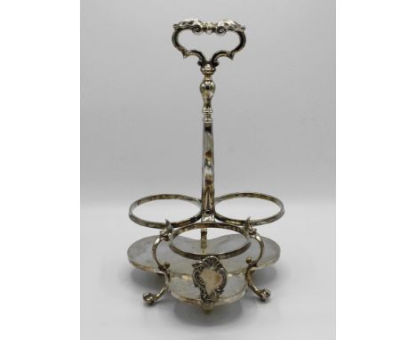  A silver plated bottle or decanter stand, early 20th century, trefoil form base and bottle deposits, vacant cartouche, long 