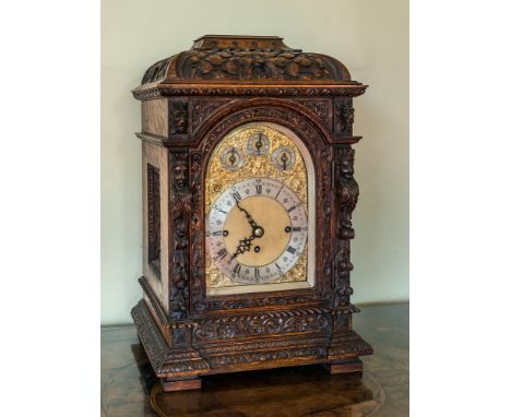  An impressive Victorian carved oak chairman's or boardroom quarter chiming triple fusee bracket clock, the case with foliate