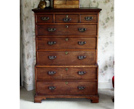  A George III mahogany chest on chest, the top with flared cornice over three short and three long graduated drawers, the sho