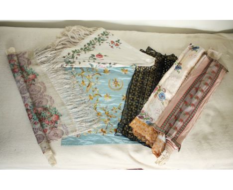 Six Victorian shawls, including one in silk with all over embroidered foliage on a turquoise ground, two in woven silk with f