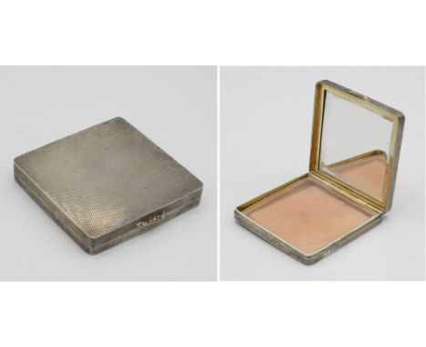  A Mappin & Webb silver compact, Birmingham 1967, square with engine turned decoration, with original puff & fine net insert,