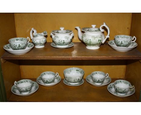  A miniature child's part dinner service, 19th century, green and white transfer print of boy archers, 18 pieces, including t