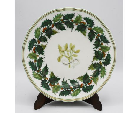  A 19th century porcelain Christmas plate, probably Copeland Spode, painted with a sprig of mistletoe and the motto 'A Merry 