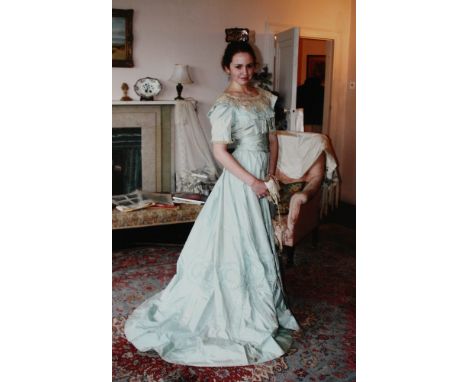  A Victorian two piece evening gown, in pale blue taffeta silk, with rufflette bow decoration to the hem of the skirt, the ja