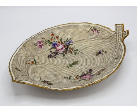 A first period Worcester porcelain double leaf dish, with moulded veining, decorated with floral sprigs and sprays on a gold 
