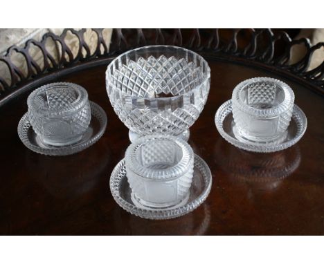  Three Georgian cut glass salts with stands, the cup shaped salts with comb cut rims over alternate panels of diamond and dia