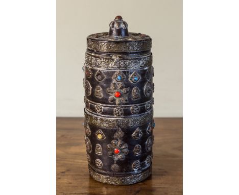  A Nepalese Raksi jar and cover, of cylindrical form, made from a large bamboo stem with brass strap work bearing repousse fl