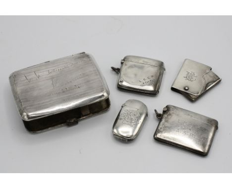  Four silver vesta cases, including examples by Hilliard & Thomason, Birmingham 1883, oval form, side hinged lid; Henry Matth