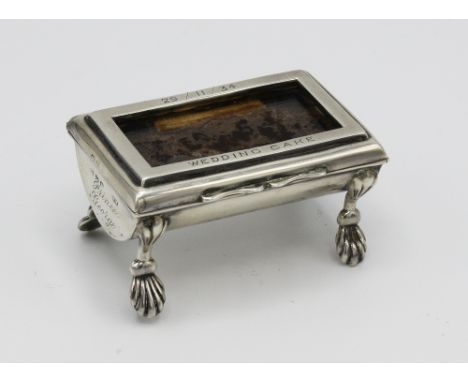  Royal interest - an unusual silver stamp box, William Neale, Chester 1900, the glazed hinged lid over bowed trough base on f