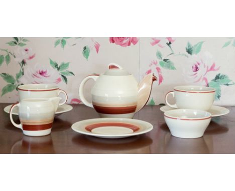  A Susie Cooper 'Kestrel' pattern part tea set, 1930s, comprising teapot, two cups, three saucers, sucrier and cream jug, pat