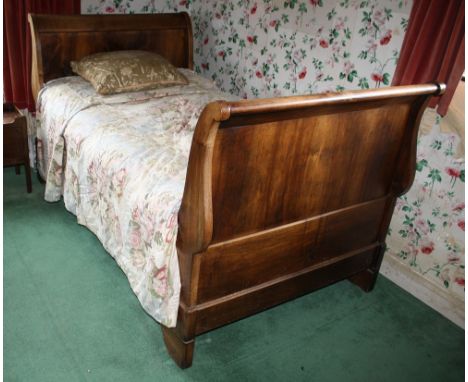  A Victorian mahogany single sleigh bed, with scrolled head and foot boards, on bracket supports, 81in. (205.75cm.) long, 45i