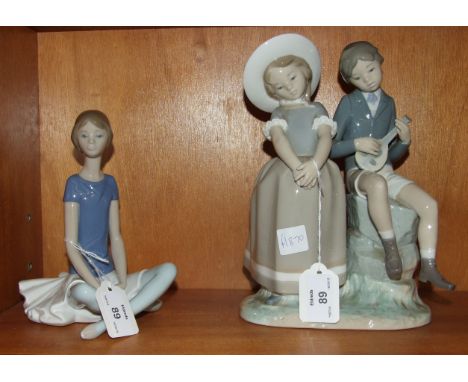 A Lladro figure of a seated ballerina, 19cm high and a figure group of a young girl and boy playing a mandolin, 24cm high, (2