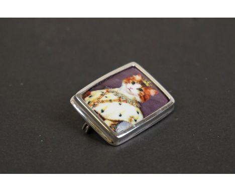 Silver and enamel brooch with pictorial image of a royal cat 