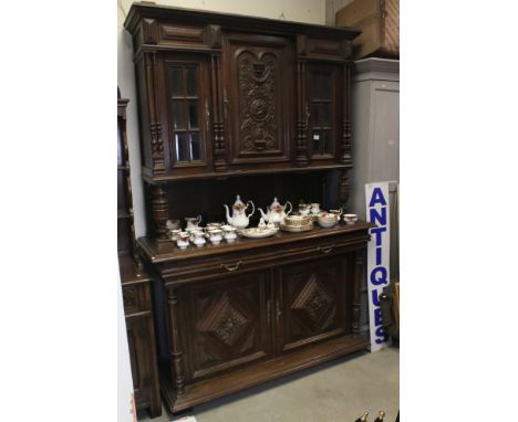 19th century style Continental Carved Oak Dresser, the upper section with central carved panel door flanked by two glazed doo