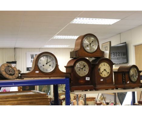 A collection of five vintage wooden mantle clocks together with a wooden wall clock. 