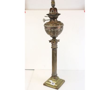 A brass corinthian column oil lamp. 