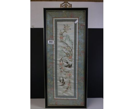 A framed and glazed Oriental silk panel with swallow bird decoration. 