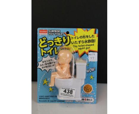 A Japanese water pistol in the form of a baby on the toilet. 