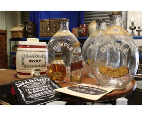Three empty Haig Whisky Dimple bottles together with a miniature bottle and a ceramic Port keg.