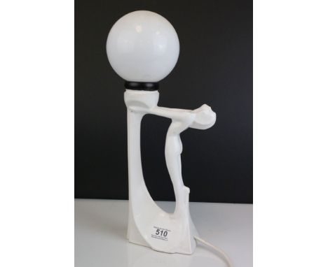An Art Deco style white ceramic table lamp. 