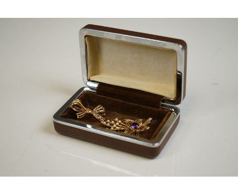 Two fully hallmarked 9ct gold brooches one with amethyst and seed pearl decoration. 