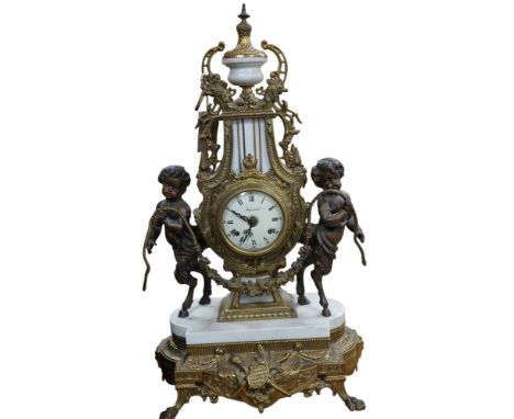 A Louis XV style brass and marble mantel clock, with key, 60cm tall. Condition - good