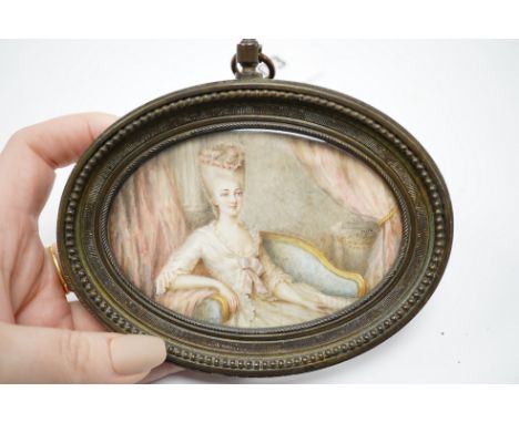 19th century, oval portrait miniature on ivory, signed nito, housed in a cast brass frame, overall 12 x 12.5cm. CITES Submiss