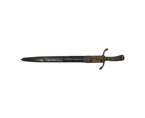 A 19th century Continental hunting hanger, blade cut with twin fullers, recurved brass crosspiece with acorn finials, staghor