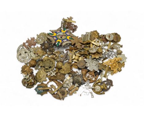 Seventy-eight military cap badges, including; the Royal Horse Artillery, the King’s Own, the Notts and Derby Regiment, the Ro