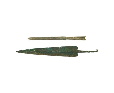 Two assorted Bronze Age spearheads, one of leaf shape with turned over tang, the other short with narrow blade. Condition - p