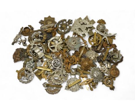 Sixty military cap badges, including; the Hampshire regiment, the South Lancashire Regiment, Prince of Wales Volunteers, the 