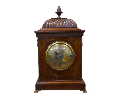 An early 20th century mantel clock, the dial inscribed J W Benson Ltd, London, with pendulum and key, 41cm high. Condition - 