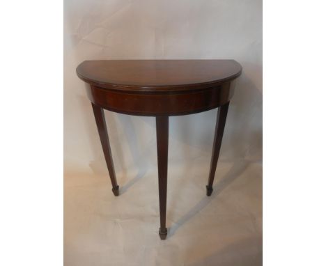 A 20th century inlaid mahogany demi lume console table, raised on tapered legs and spade feet, H.74 W.60 D.34cm 